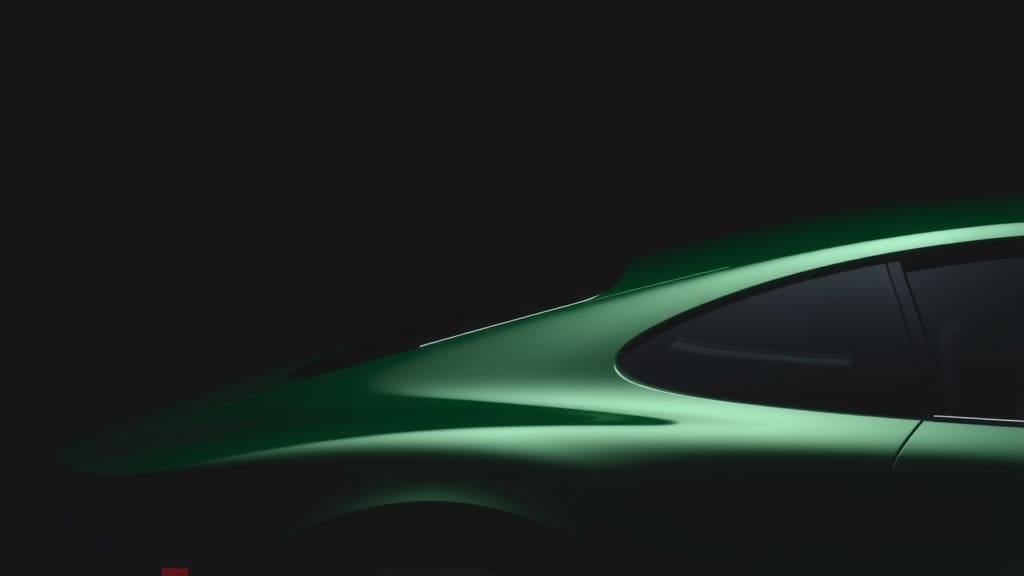 Silhouette of a green sports car roofline in low light