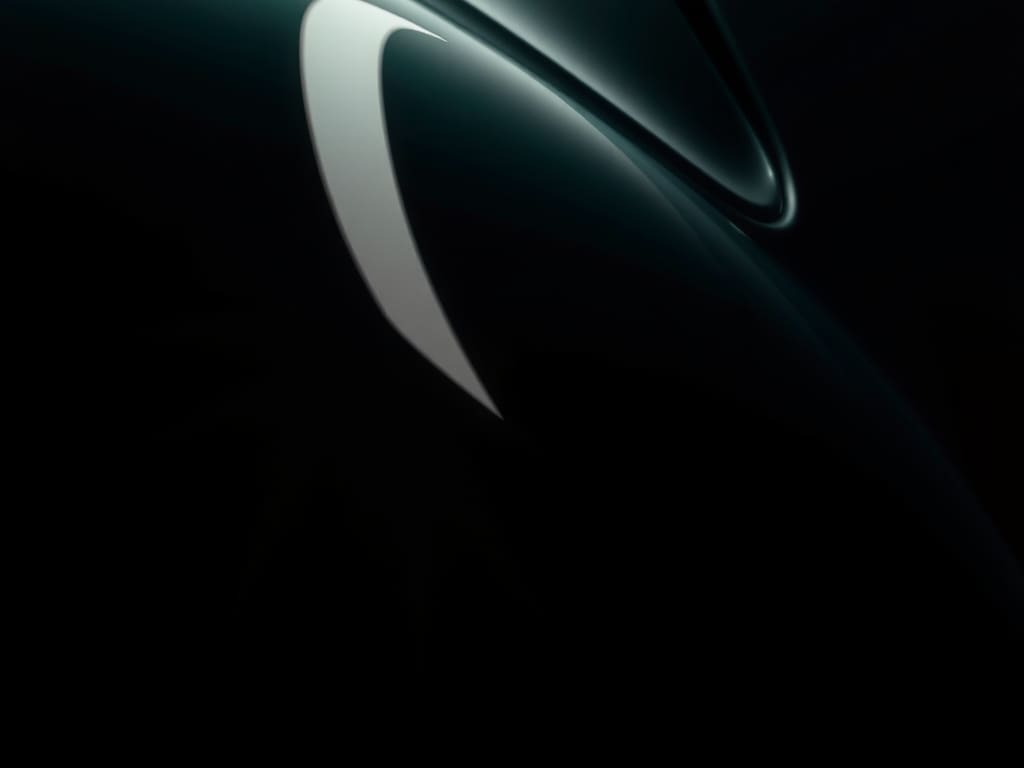 Light reflecting along dark green bodywork